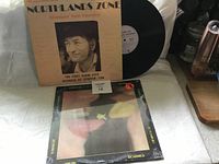 Front cover of 'Northlands Zone' vinyl album by Stompin' Tom Connors with vinyl record partially visible.