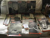 Full view of all QST magazines showing the various front covers with radio schematics and equipment images.