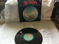 Front cover of Heart Magazine vinyl record album showing artwork and branding with the record and insert displayed on white cloth background.