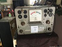 Front view showing all sockets, knobs, and the analog meter labeled with 'Replace', 'Bad', and 'Good'.