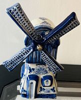 Photo of the blue and white porcelain musical windmill showing detailed view of blades and floral design