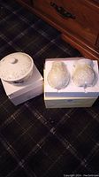 Lenox lidded dish and salt and pepper shakers in original boxes shown on carpet surface.