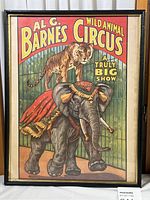 Front image of framed vintage circus poster featuring tiger and elephant with decorative elements, titled Al G. Barnes Wild Animal Circus.