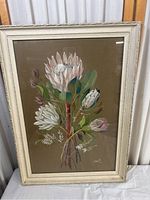 Full view of the framed floral print showing protea flowers and the frame details.