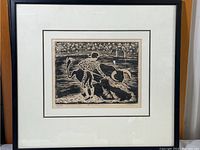 Framed bullfight print showing the entire artwork within a black frame and white matting, presenting the full composition of the bull and bullfighter in an arena.