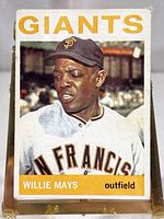Front image of the 1964 Topps #150 Willie Mays baseball card showing player's portrait in Giants uniform with team name and player info banner.