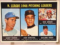 Front side of the card showing the four pitchers as the 1966 National League pitching leaders with the names and teams.