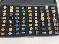 Full overhead view of 36 cufflink pairs in fitted case