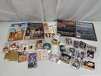 Full overview of all items including magazines, yearbooks, trading cards, pins, ticket stubs, and Barry Bonds ball.