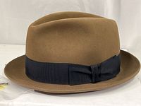 Brown felt Dobbs Golden Coach fedora hat showing front and side views with black grosgrain ribbon band and bow