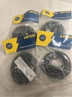 Four Watson power outdoor extension cords in original packaging, showing 10 feet and 15 feet lengths