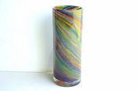 Front and side views of a tall cylindrical vase made of clear glass with multicolored swirls in blue, green, red, yellow and purple. Handcrafted with no chips or cracks, pontil mark visible on the bottom indicating artisan production.