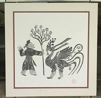 Full view of framed vintage black and white woodcut print depicting a human figure and a mythical bird, mounted on matte board.