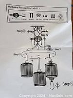 Instruction diagram showing assembly steps and included hardware for three-light chandelier.