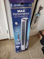 Photo of the Lasko Max Performance 40" power fan in its original box showing product features and branding.