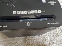 Top view of the black Concept Solutions PSC62-7 paper shredder showing paper feed slot and model branding.