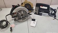 Three power saws on table showing overall lot including SKIL, Black & Decker circular saws and Presto jigsaw.