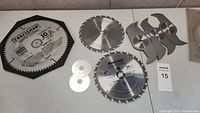 Lot of various saw blades including Craftsman and Mastercraft blades and small circular blades with multi-blade attachments