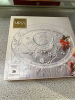 Boxed Mikasa Holiday serving dish with clear glass holly leaf embossed design and central bowl for dips