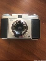 Front view of vintage Contina Prontor-SVS camera showing lens and front body details.