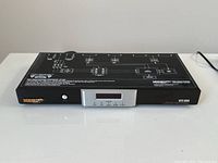 Front view of Monster Power HTS1600 home theater power center showing digital display, control buttons, and branding.