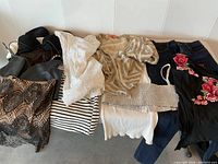 Overview of all clothing items spread on a surface