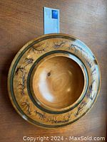 Top view of cherry wood bowl showing the black epoxy-inlaid electric burn pattern decorating the outer rim.