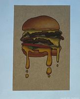Photo of a paper gift certificate with an illustrated double cheeseburger dripping with melted cheese.