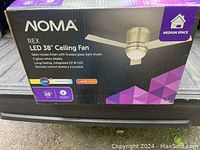 Box of NOMA Rex LED 38" Ceiling Fan highlighting features: satin-nickel finish, frosted glass light shade, 3 gloss-white blades, integrated 22W LED and remote control.