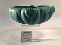 Front view of the blue-green Van Briggle ceramic vase showing tulip and leaf design on the body.