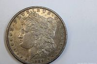 Obverse view of 1889 Morgan Silver Dollar showing Lady Liberty and date.