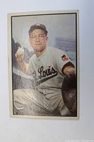 Front of 1953 Bowman Clint Courtney baseball card, showing the catcher in uniform with baseball in hand.