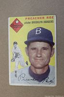 Front side of Preacher Roe baseball card showing colorful portrait, team logo, and signature.