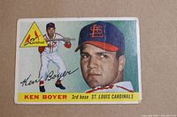 Front view of 1955 Topps Ken Boyer rookie baseball card with player portrait, minor creases, and corner wear.