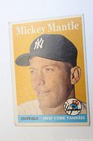 Front of 1958 Topps Mickey Mantle card showing bust portrait and team logo