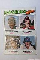 Front of the 1977 Topps Rookie Catchers card featuring four players with their photos and team names.