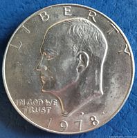 Obverse side of the 1978 Eisenhower dollar coin showing President Eisenhower's profile and inscriptions.