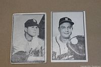 Front of two 1953 Bowman black and white baseball cards showing Walker Cooper (left) and Virgil Trucks (right).