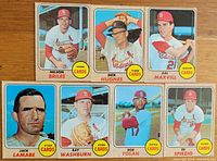Front side of seven 1968 Topps baseball cards featuring St. Louis Cardinals players: Nelson Briles, Dick Hughes, Dal Maxvill, Jack Lamabe, Ray Washburn, Bob Tolan, and Ed Spiezio.