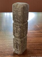 Front view showing all three carved sections