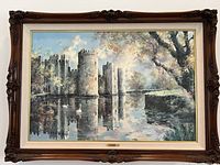 Full view of the framed oil painting depicting Bodiam Castle at twilight with water reflection, swans, and trees.