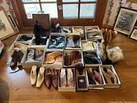 Front view showing rows of assorted boots, ankle boots and mules on floor