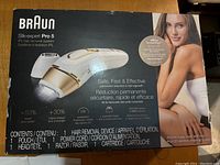 Front of retail box showing device branding, performance claims and contents list