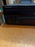 Close-up of front panel with Pioneer branding and model number CLD-920, showing disc tray and control buttons.