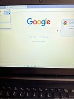 Front view of laptop screen displaying Google search page