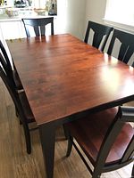 Angled view of tabletop and surrounding chairs