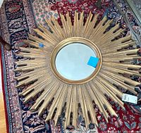 Top-down view of entire mirror on patterned rug