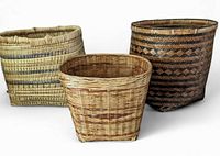 Front view of three woven storage baskets arranged side by side showing color variation and size differences.