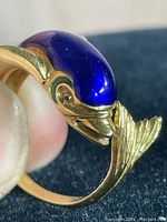 Dolphin ring profile showing blue enamel and gold fins