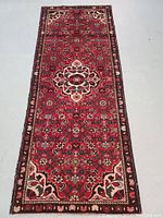 Full view of rug laid flat showing overall design and condition
